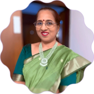 A portrait of Vijayalakshmi Sundaram, Deputy GM at SBI, wearing a green saree.